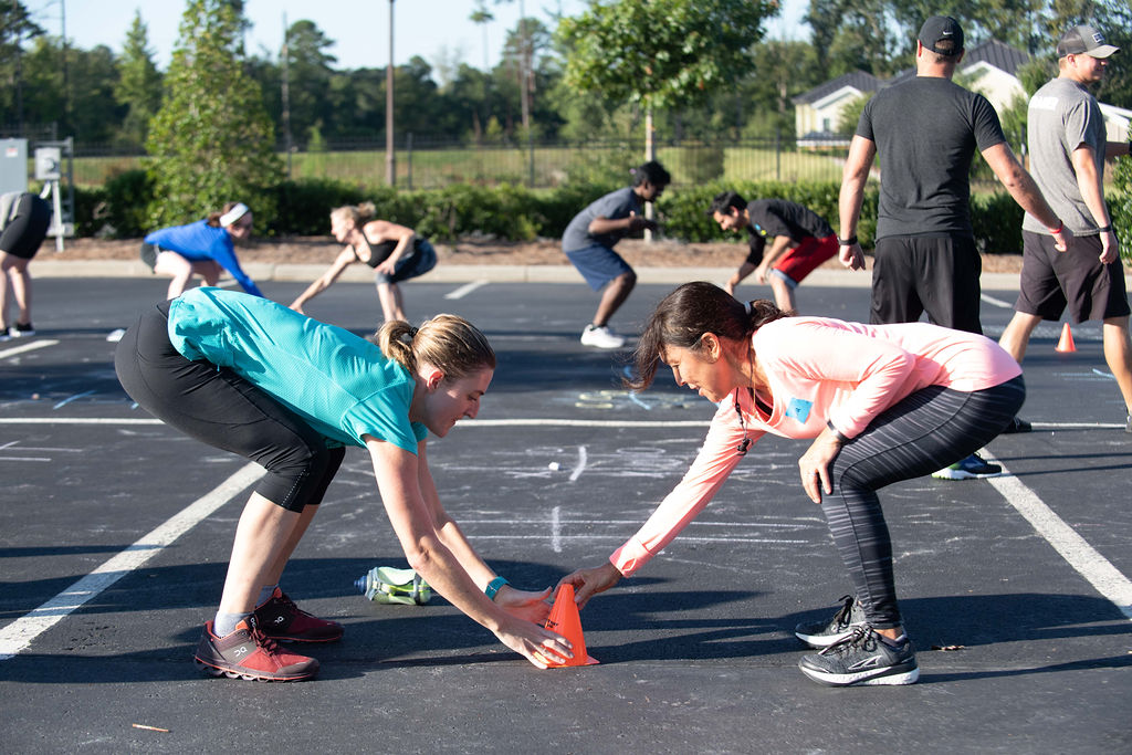 people working out in parking lot