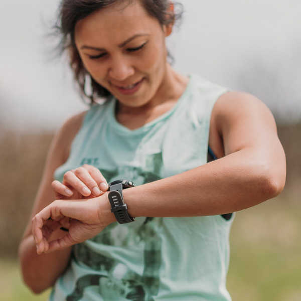 woman looking at watch