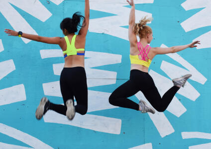 two women jumping