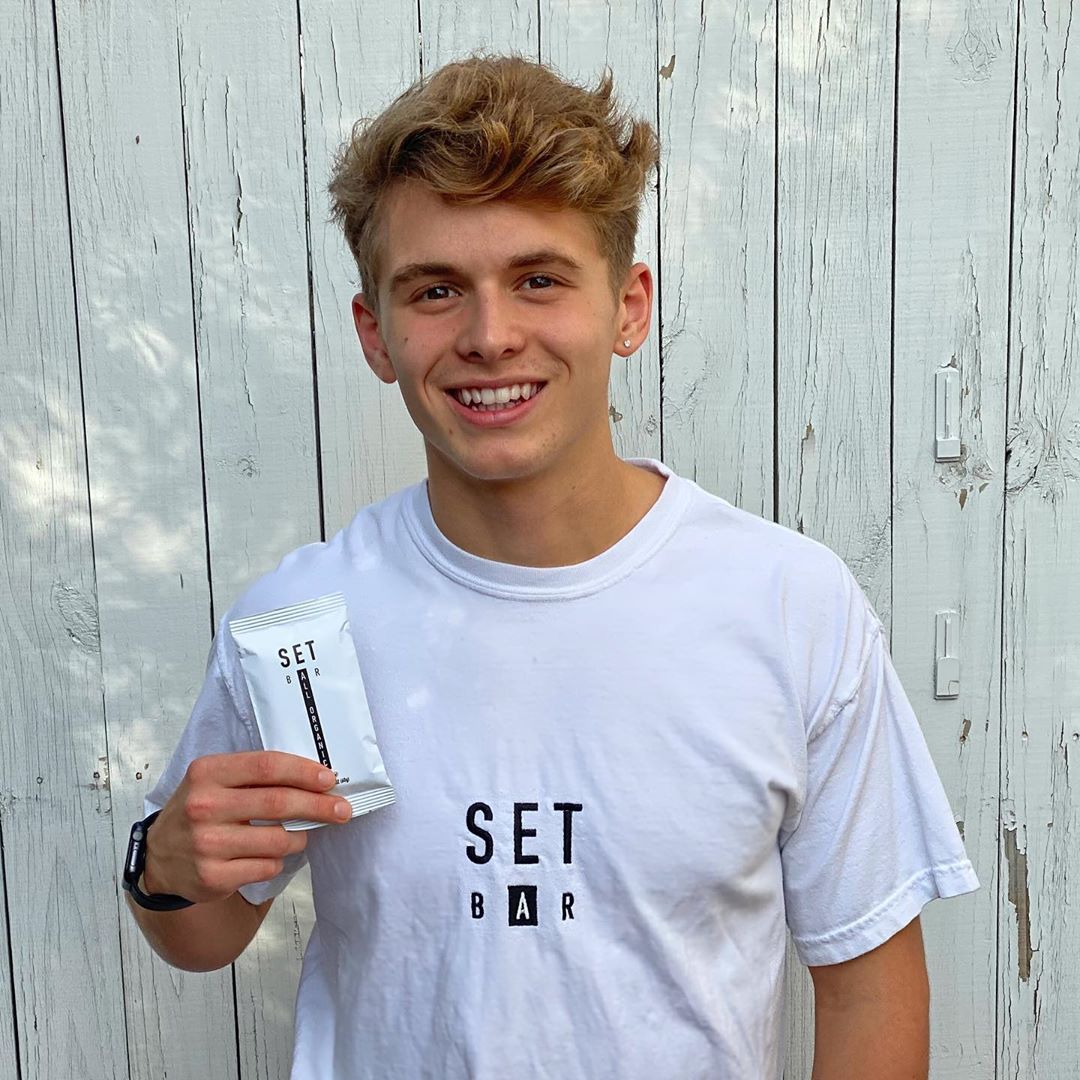 photo of carter bouchard holding a setbar