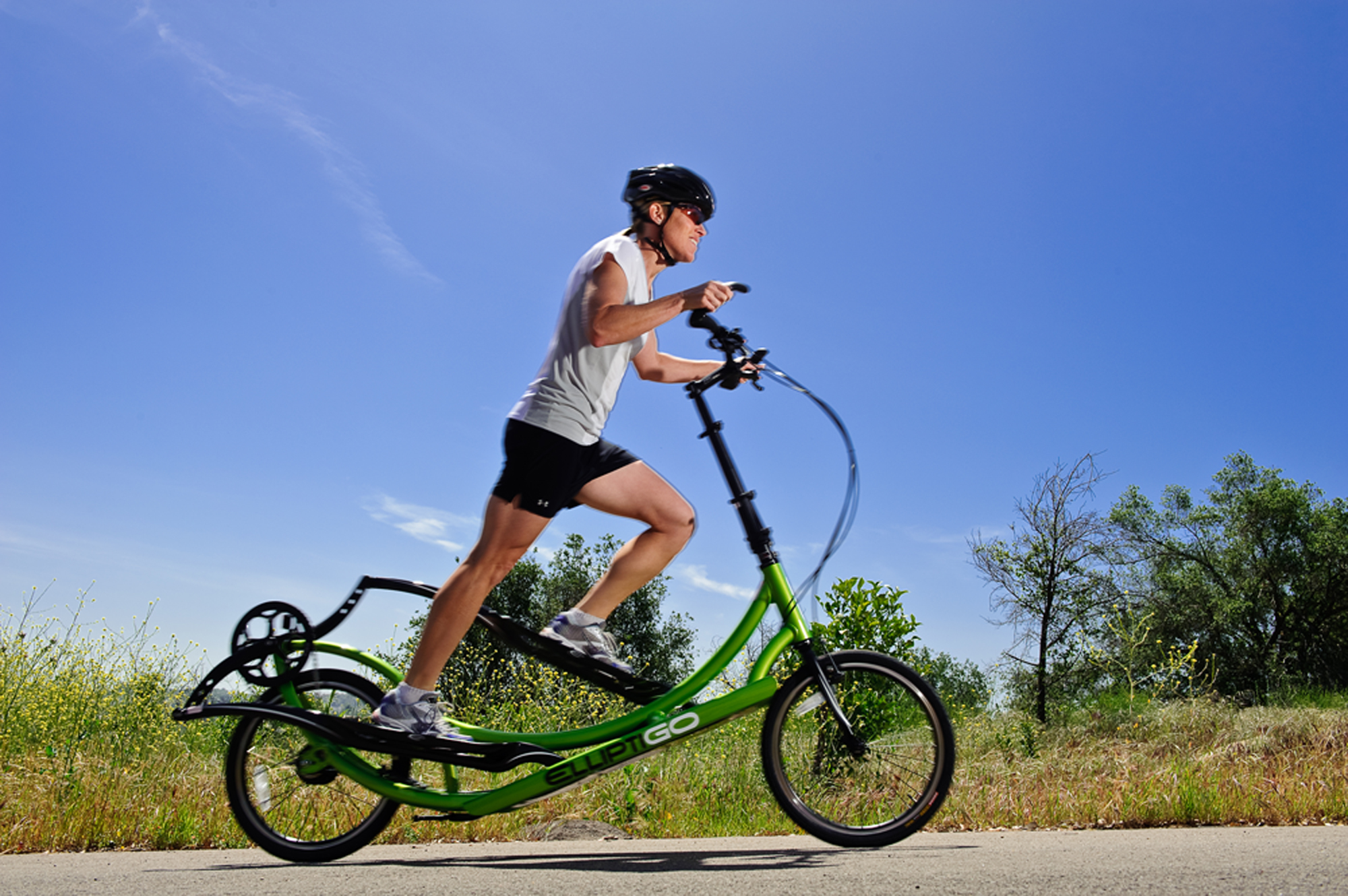 man riding elliptigo