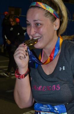 Alexis with NYC marathon finisher medal