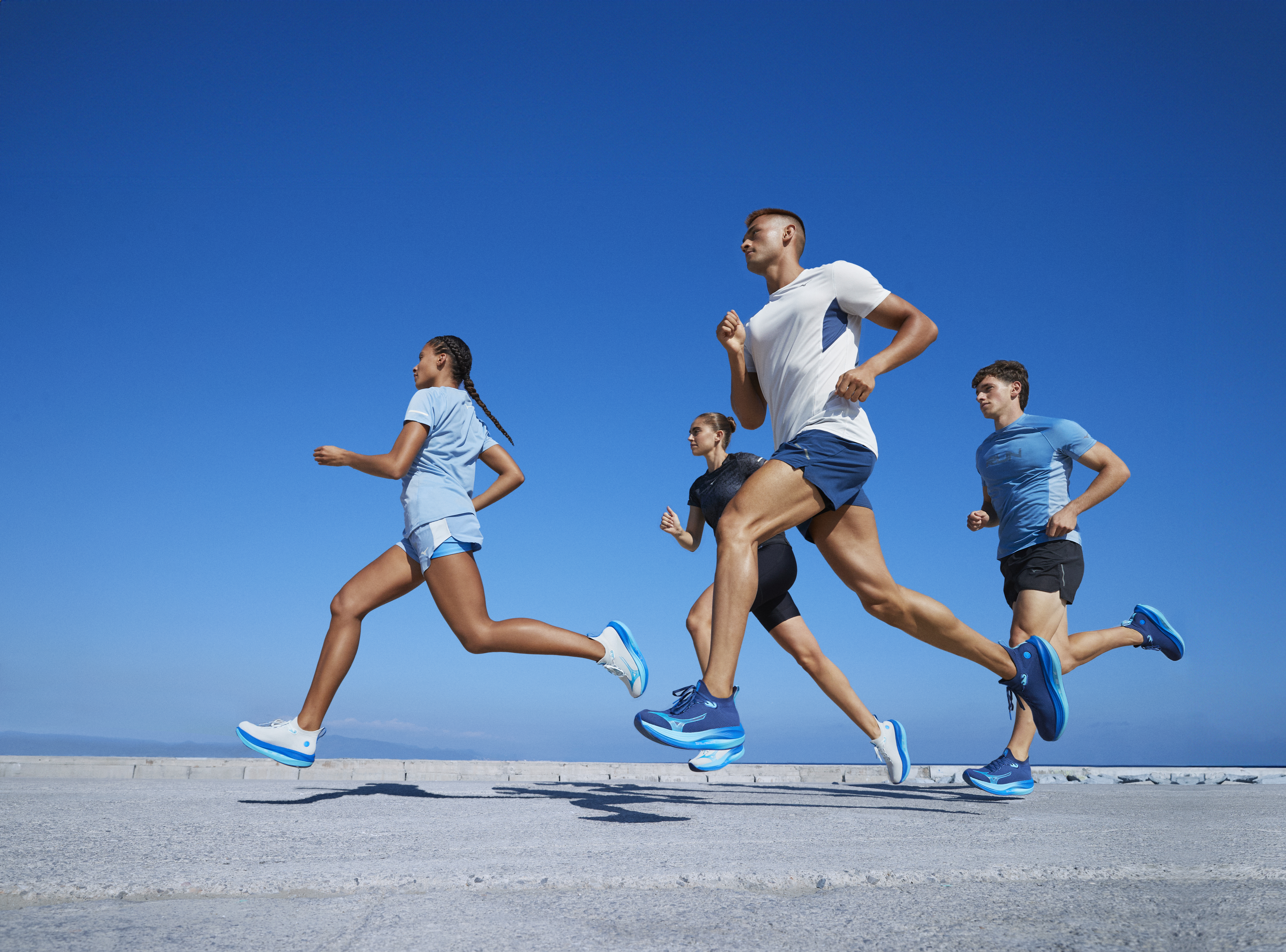 men and women running in the Mizuno Neo Vista