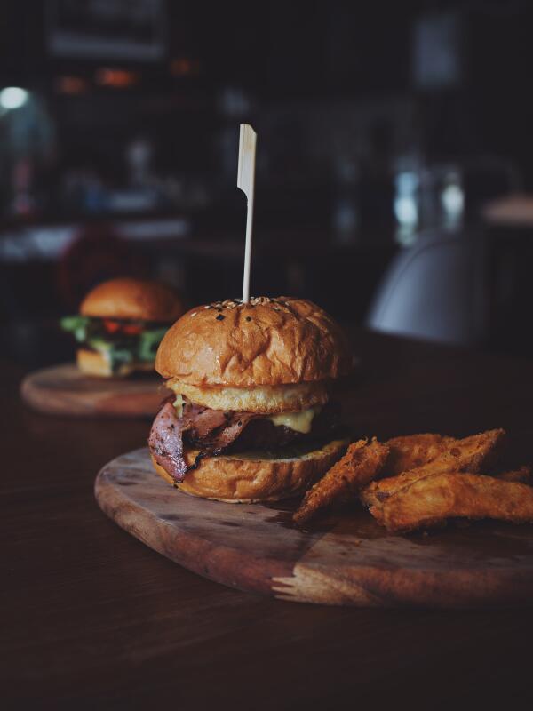 Burgers served on wood platter