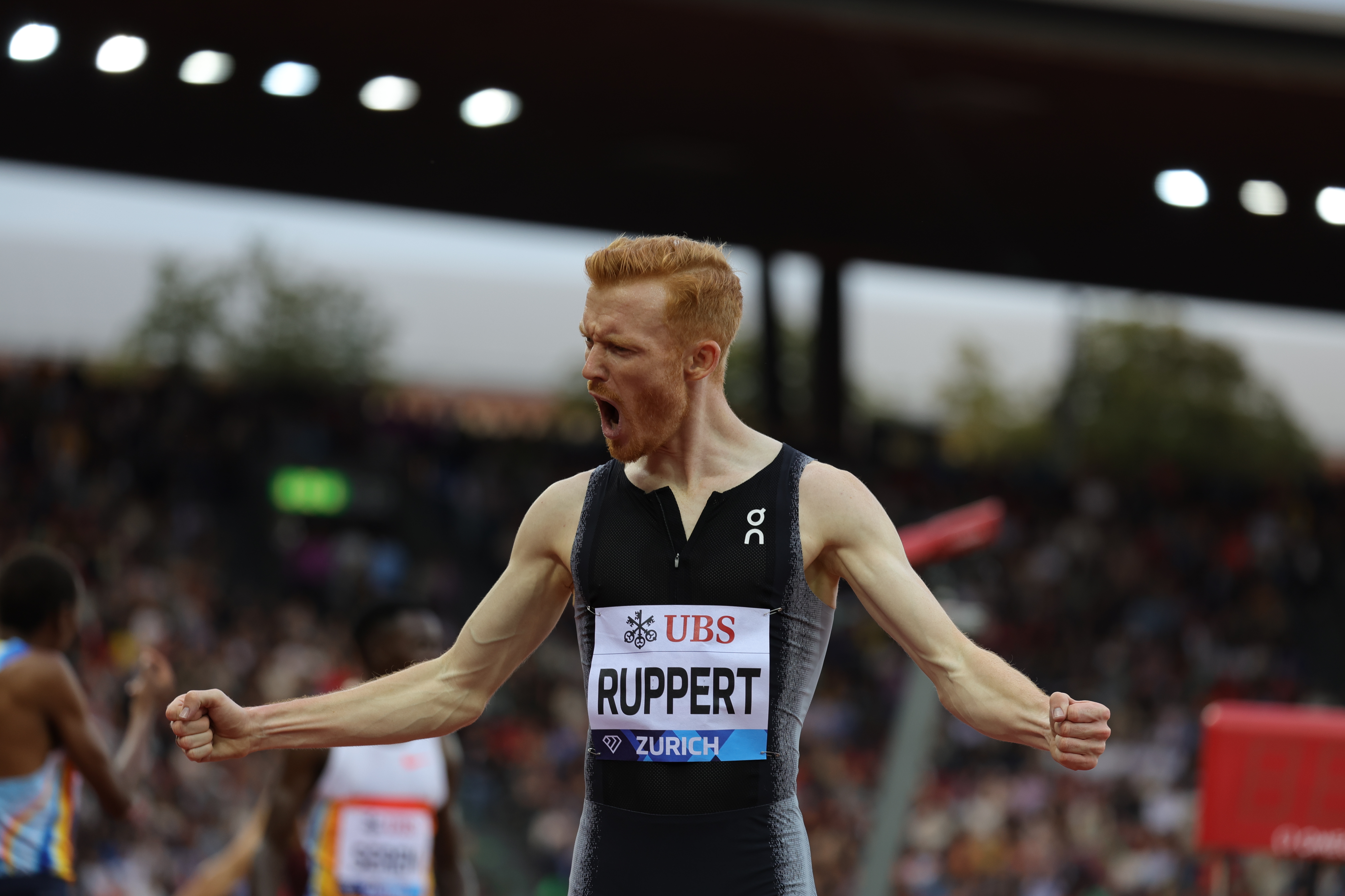 An athlete celebrating after Diamond League race