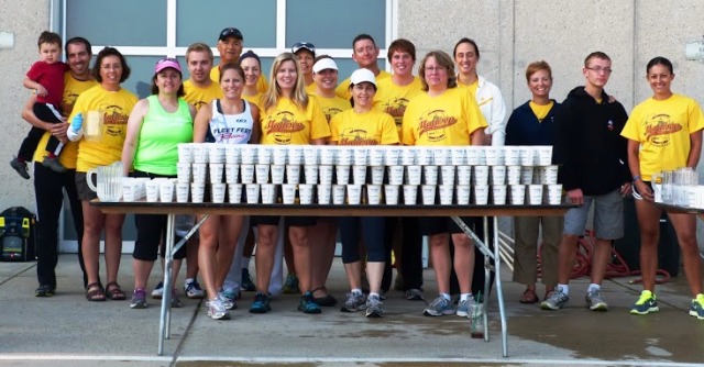 Fleet Feet Madison & Sun Prairie volunteer aid station for the Madison Mini Marathon & 5K