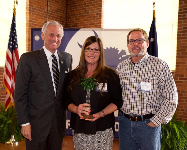 Company leaders from Anderson Hydra Platforms accept an Industry Impact Award. They are joined by Governor Henry McMaster.