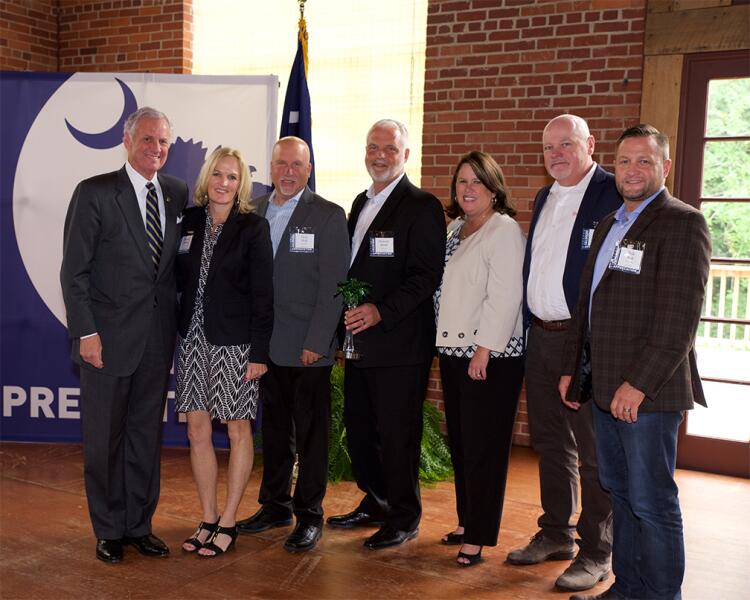 Company leaders from Shutterfly accept an Industry Impact Award. They are joined by Governor Henry McMaster.