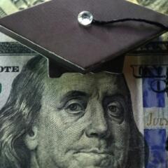 100 dollar bill with graduation cap