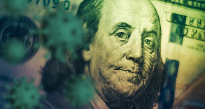 artistic shadowed rendering of Benjamin Franklin's face on the hundred dollar bill
