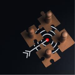 4 wooden puzzle pieces over target