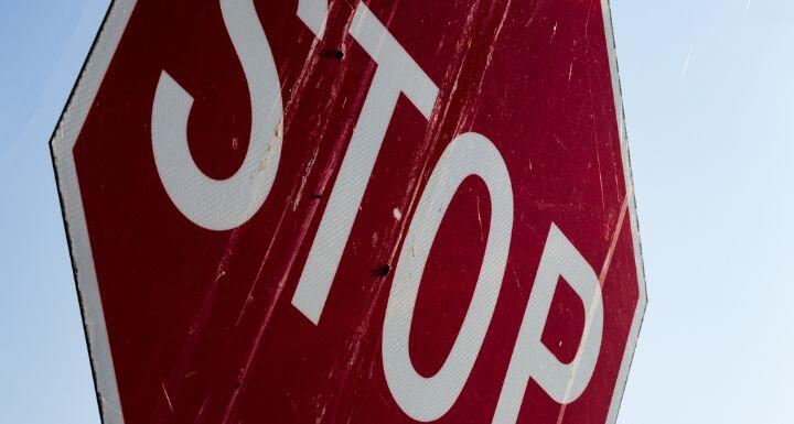 close up of an old dirty stop sign