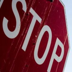 close up of an old dirty stop sign