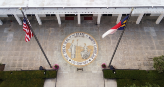 Aerial view of the North Carolina State legislature building with the state seal