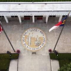 NC state legislature building with state seal 