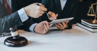 At the meeting, a team of lawyers discussed the lawsuit