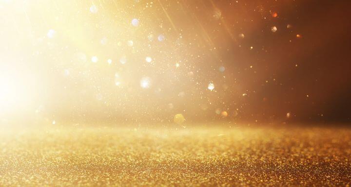 Background of abstract gold and silver glitter lights
