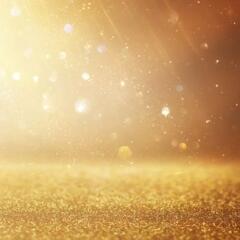 Background of abstract gold and silver glitter lights