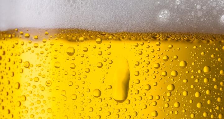 Close up shot of beer glass with dew