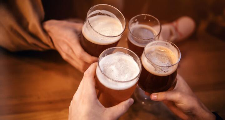 beer toasting with four friends