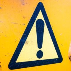 Exclamation point on a triangle sign indicating caution