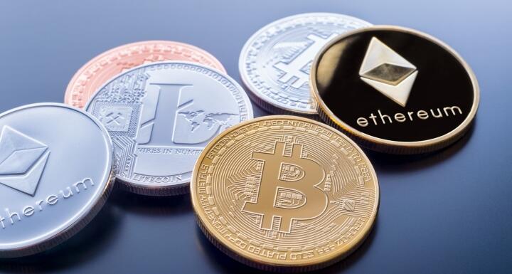 Coins with the logos of Bitcoin and Ethereum stamped on the faces