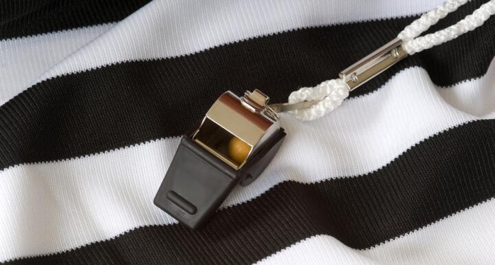 Black and white referee shirt with black whistle 