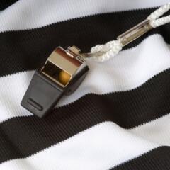Black and white referee shirt with black whistle 
