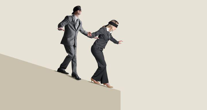 Blindfolded Man And Woman Attempting To Navigate Their Way