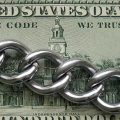 The back of a dollar bill with a chain across it