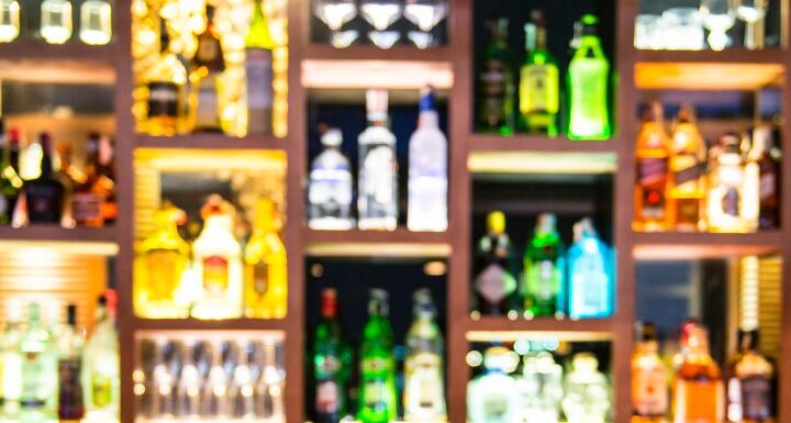 Blurred bottles of liquor at a bar