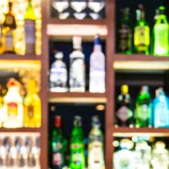 Blurred bottles of liquor at a bar