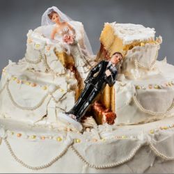 broken wedding cake with bride and groom topper split up