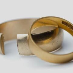 Broken wedding righs on white background