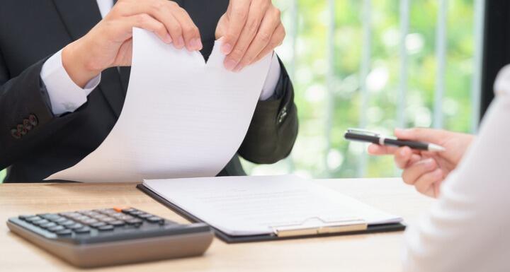 Businessman ripping paper