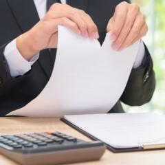 Businessman ripping paper