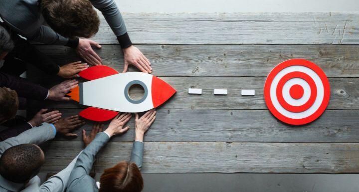 Business people with rocket