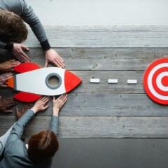 Business people with rocket 