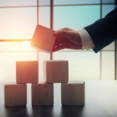 businessman building blocks