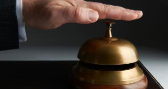 Businessman Ringing Service Bell