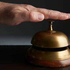 Businessman Ringing Service Bell