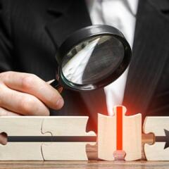 Businessman explores a wrong puzzle piece