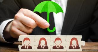 Businessman holding umbrella over puzzle pieces with business people avatars