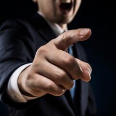 Businessman sticks out a finger 