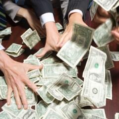 Businesspeople grabbing money