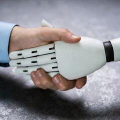 Businessperson And Robot Shaking Hands 
