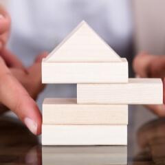 A small house made of Jenga blocks