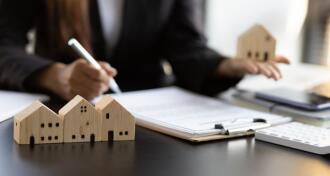 Businesswoman signing a contract to legally for the purchase, mortgage and rental of real estate