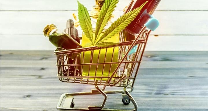 CDB products and hemp leaf in small shopping cart