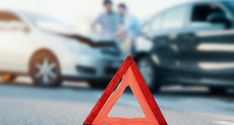 Two cars in accident with red caution triangle